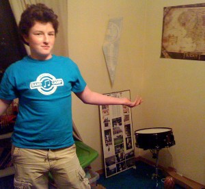 The boy puts together the snare drum from his early Christmas gift . . . only 4 pieces left and a stool . . . 